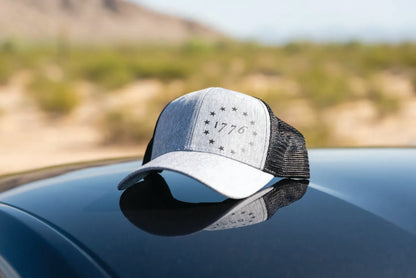 Grey and black mesh 1776 snapback with black We The People shirt